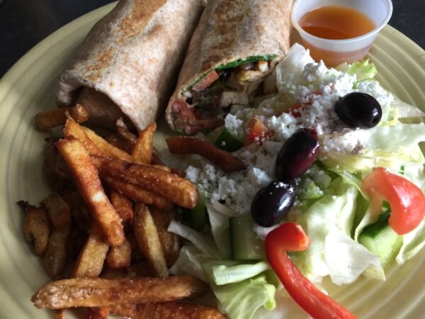 Full Plate With Rice, Roast Potato, Greek Salad.