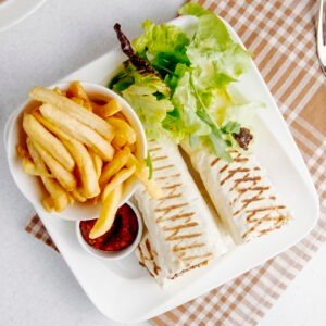 Veggie Wrap With Fries And Tzatziki Sauce.