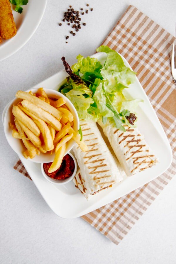 Veggie Wrap With Fries And Tzatziki Sauce.